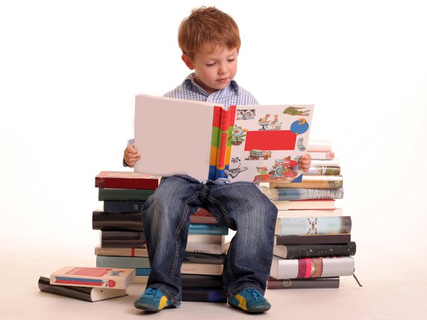 child with stack of books.jpg