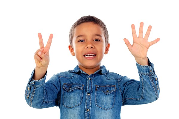 boy holding up seven fingers.jpg