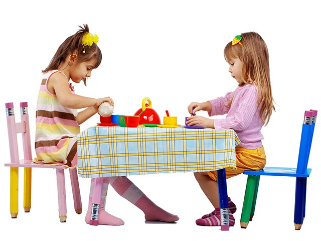 2 little girls playing with tea set isolated.jpg